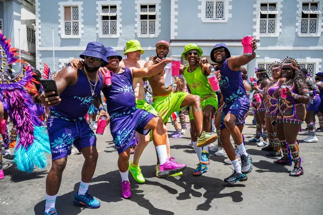 Friends celebrating in costume at Vincy Mas carnival